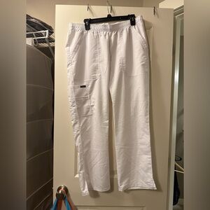 White Nurse pinning Pants